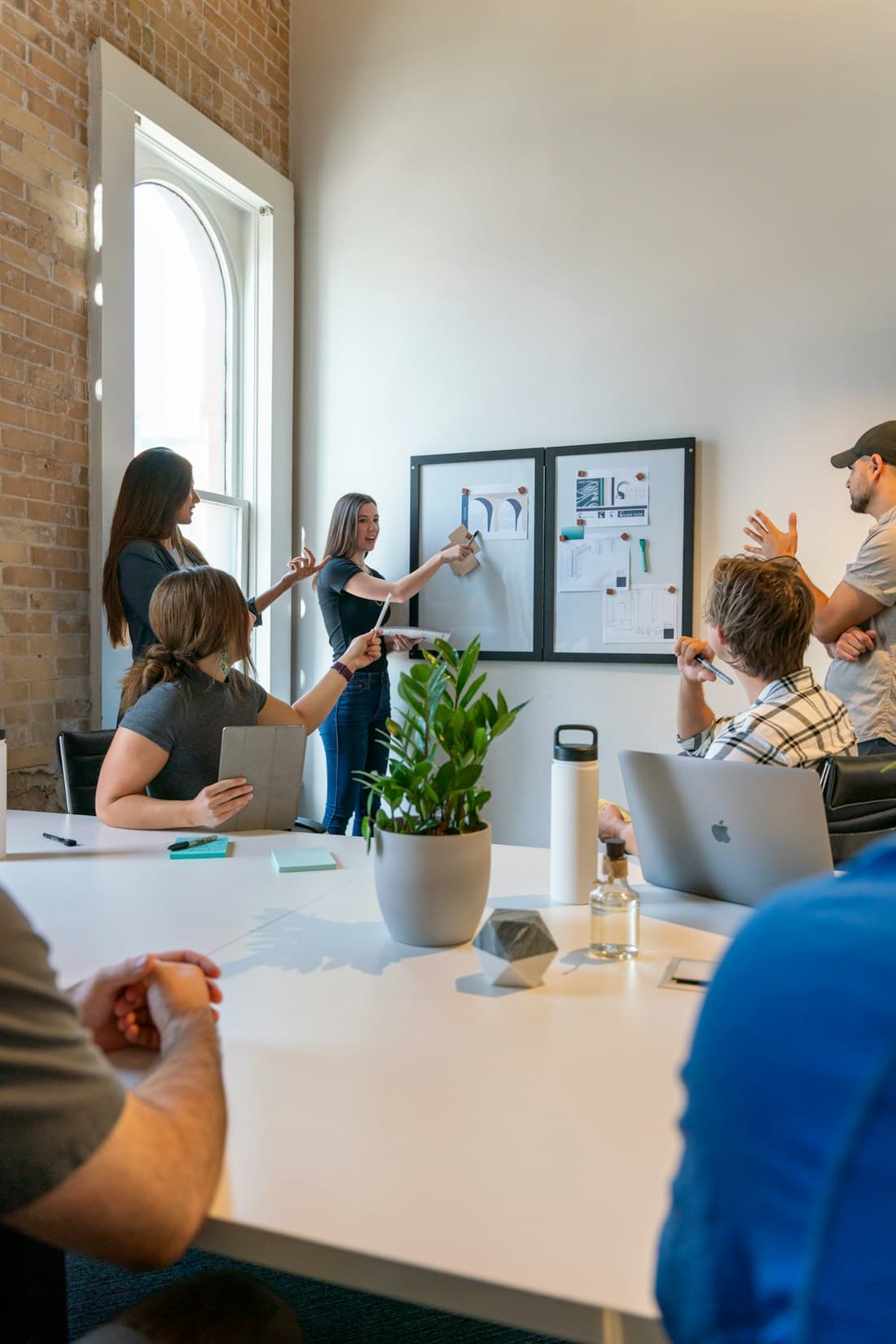 A small business team planning together around a meeting table